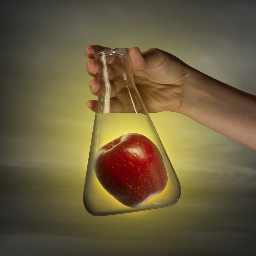 Lab flask with apple inside